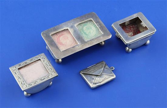 An Edwardian silver demi-lune double stamp box, 2 singles and an envelope.